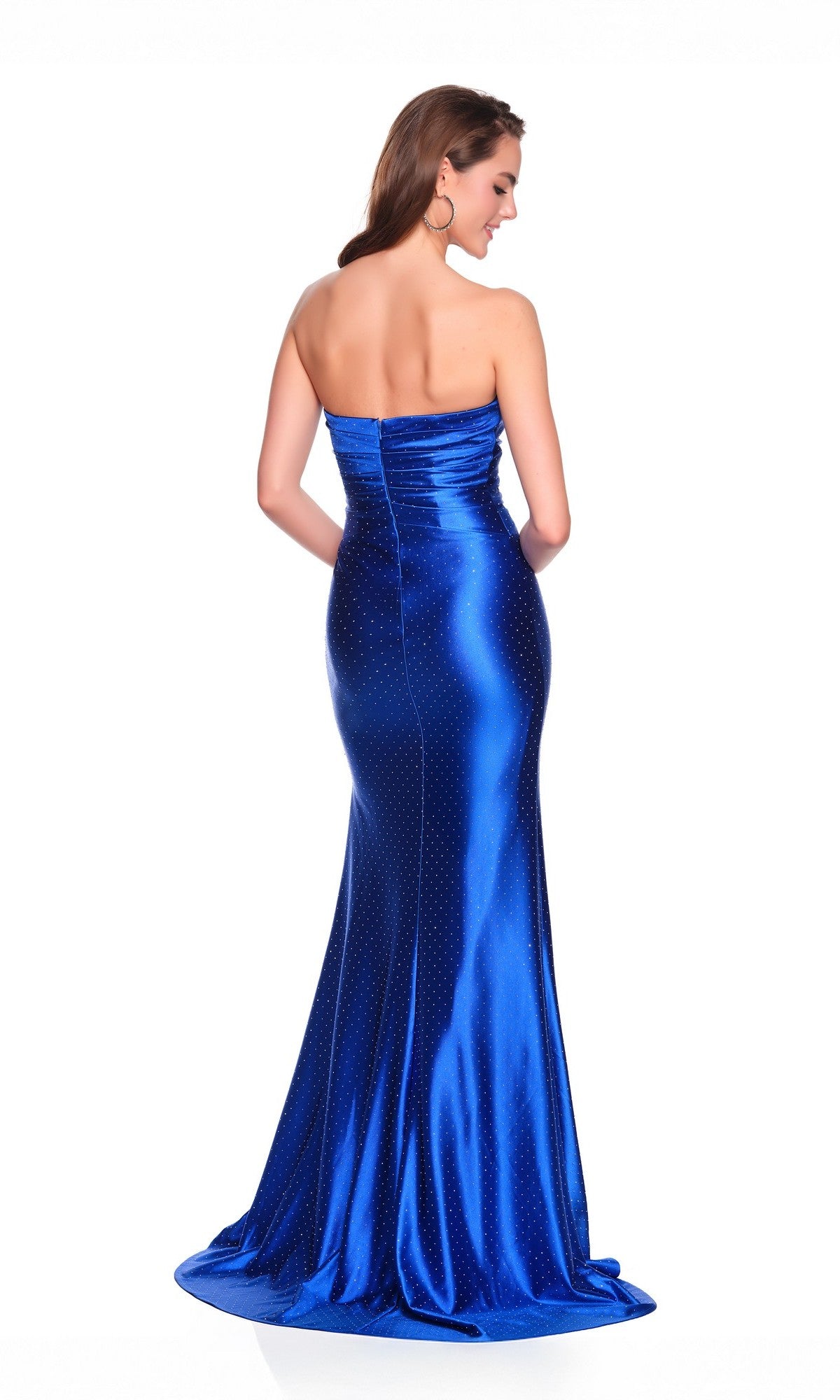 A woman faces away in the Dave and Johnny 12769 long prom dress—satin blue, strapless, with a fitted bodice and slight train—set against a white background.
